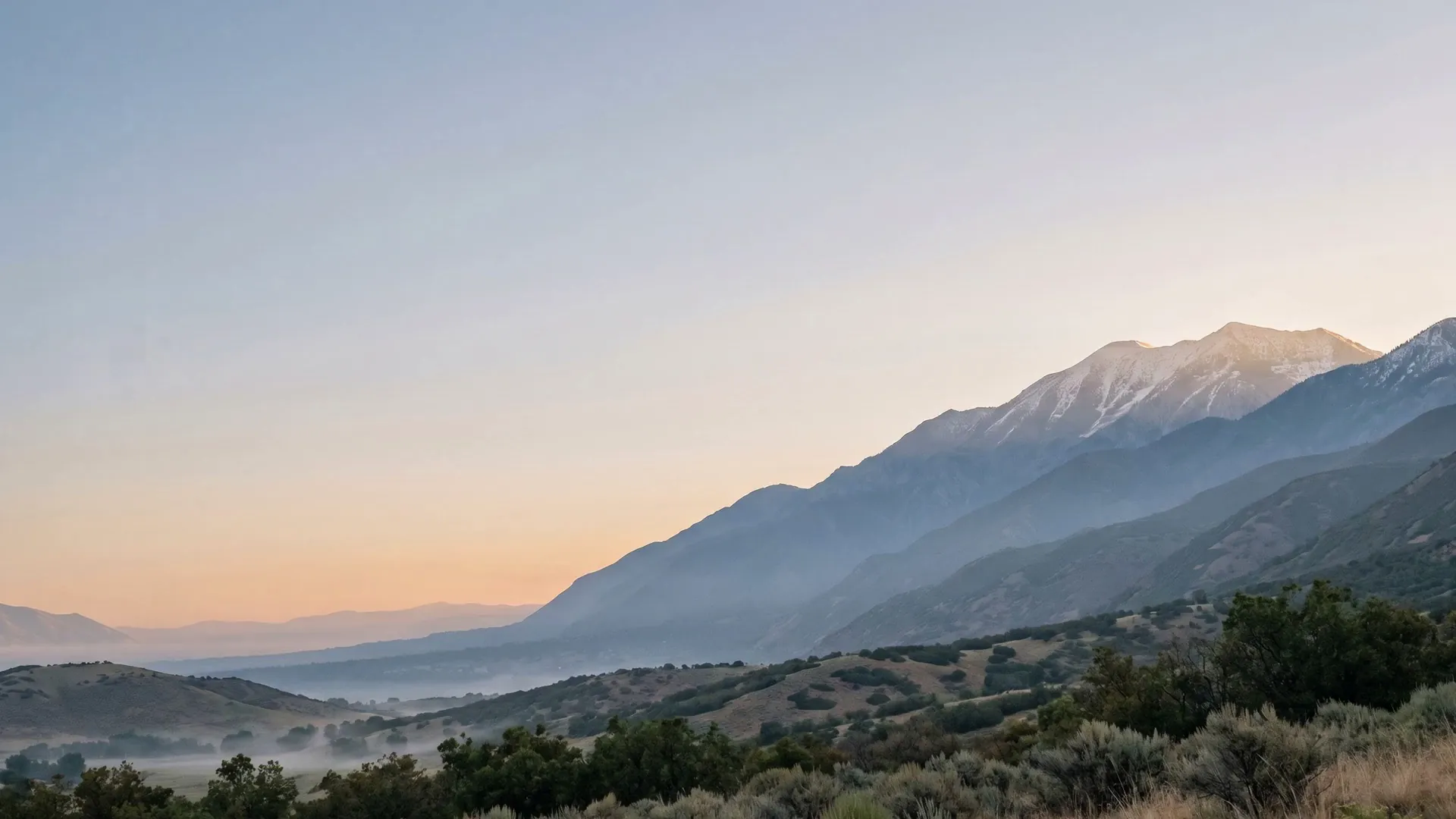 First light on the Wasatch Front above a misty Salt Lake Valley