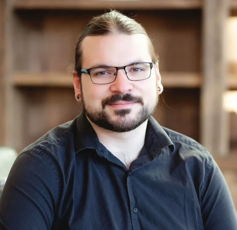 Zachary Wise, owner of Articulate Vision, smiling in a professional headshot for a digital marketing blog.